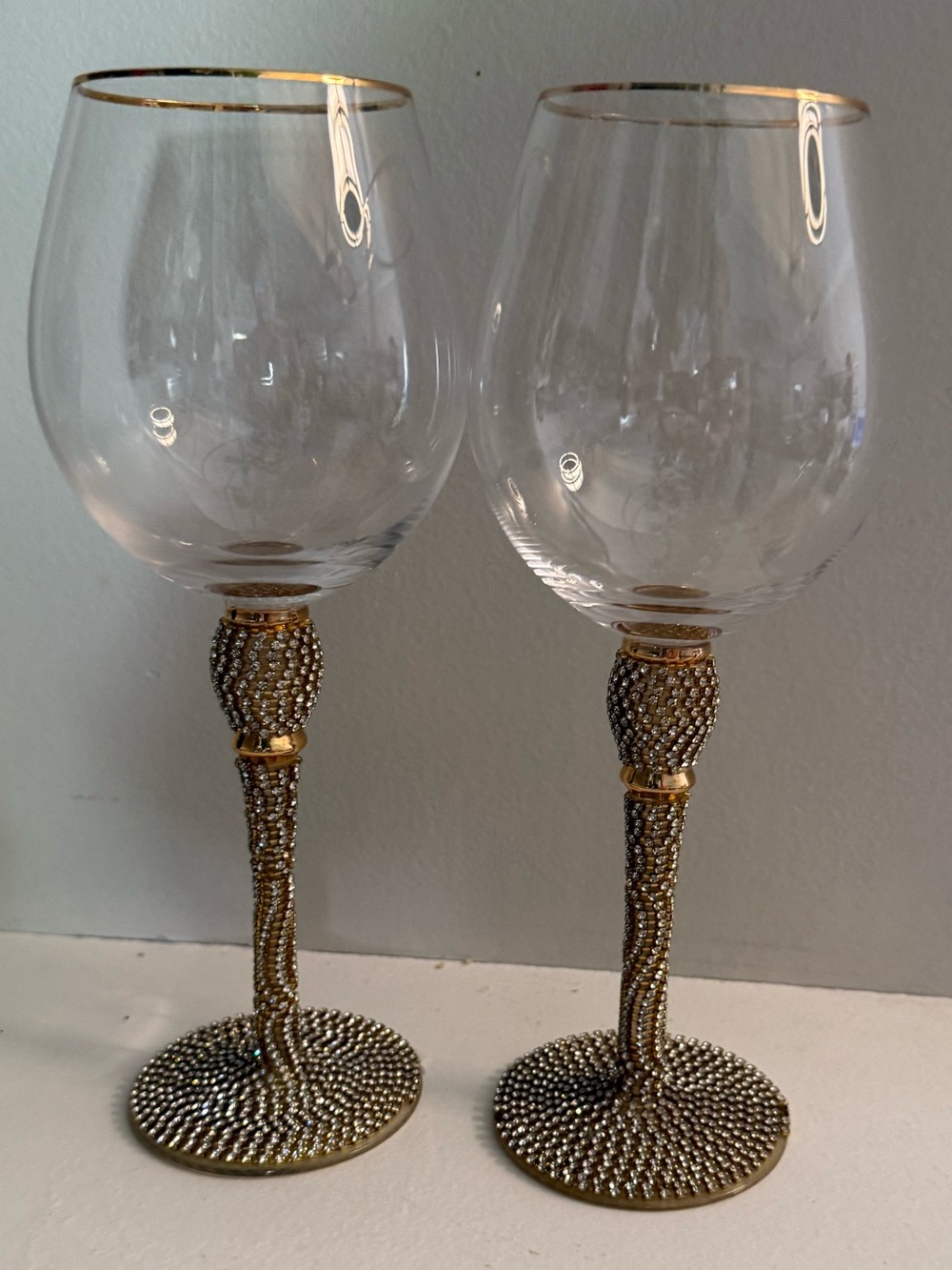 2 rhinestone-studded wine glasses w/gold rims & embellished crystal stems. 16 oz